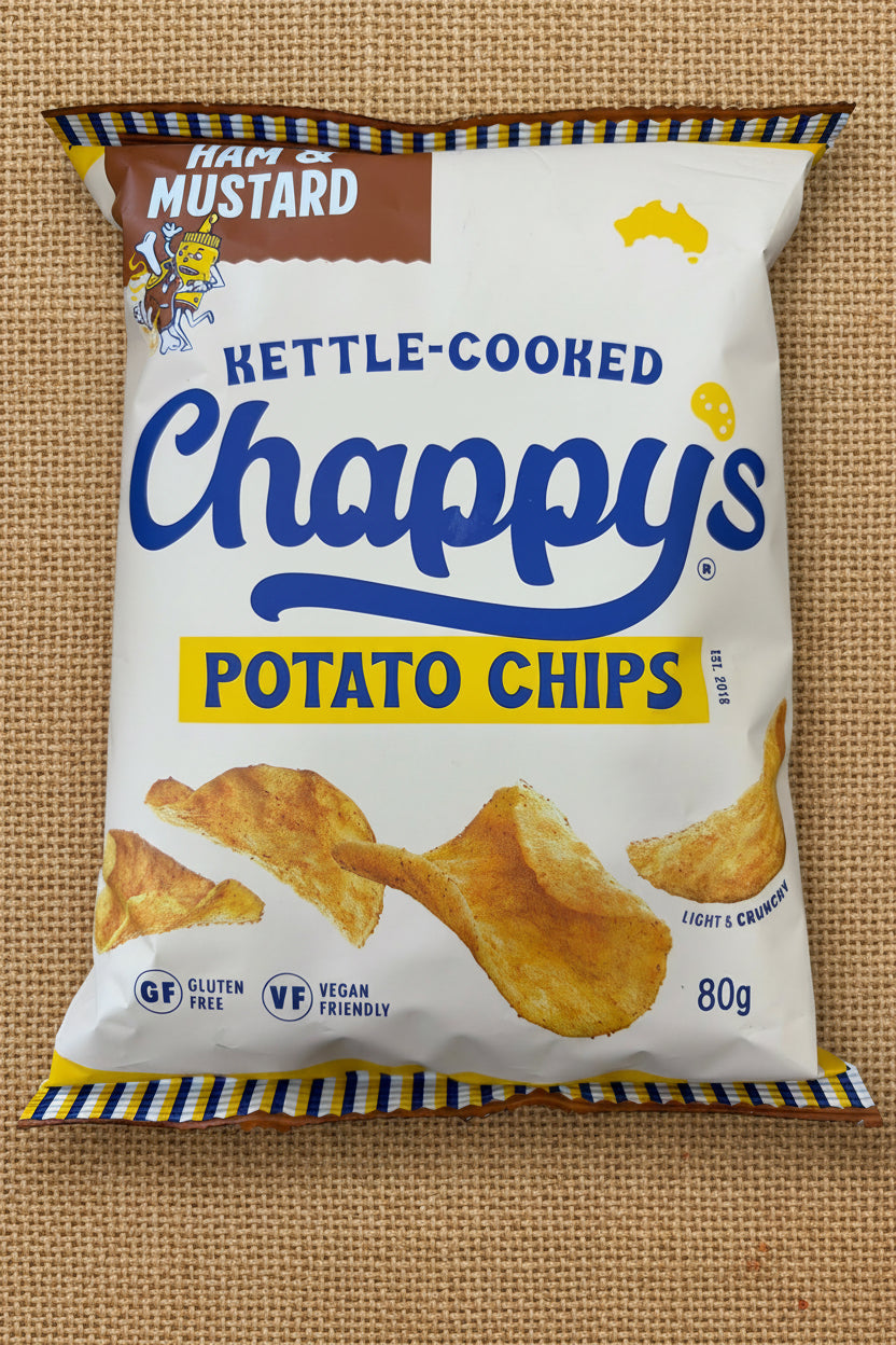 Packaging of Chappy's kettle-cooked potato chips on a textured surface